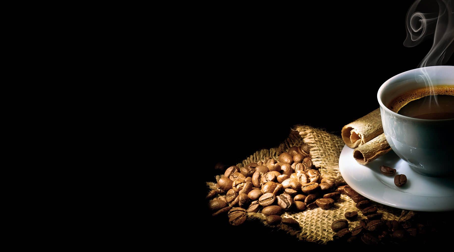 Steaming cup of coffee on cafe counter