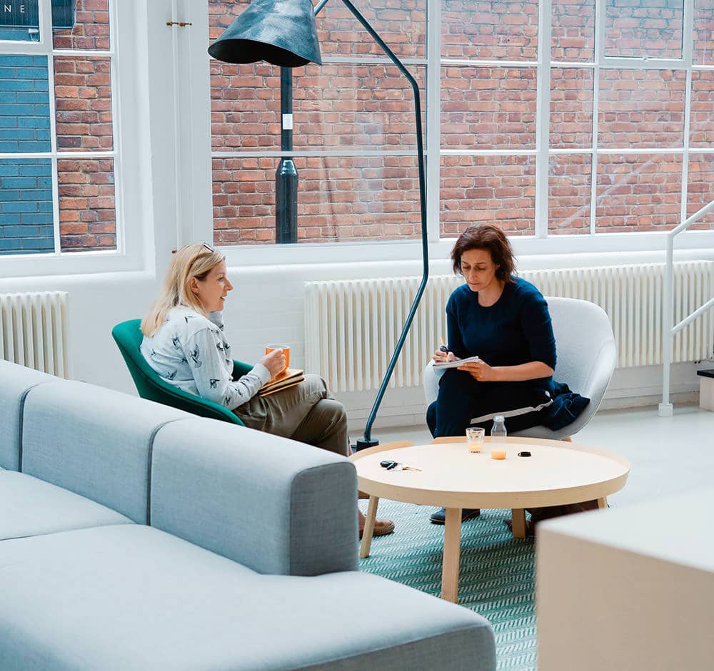 Team collaborating at shared desks in our coworking space