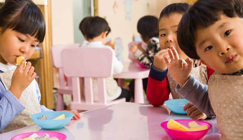 Children receiving learning materials through donation drive